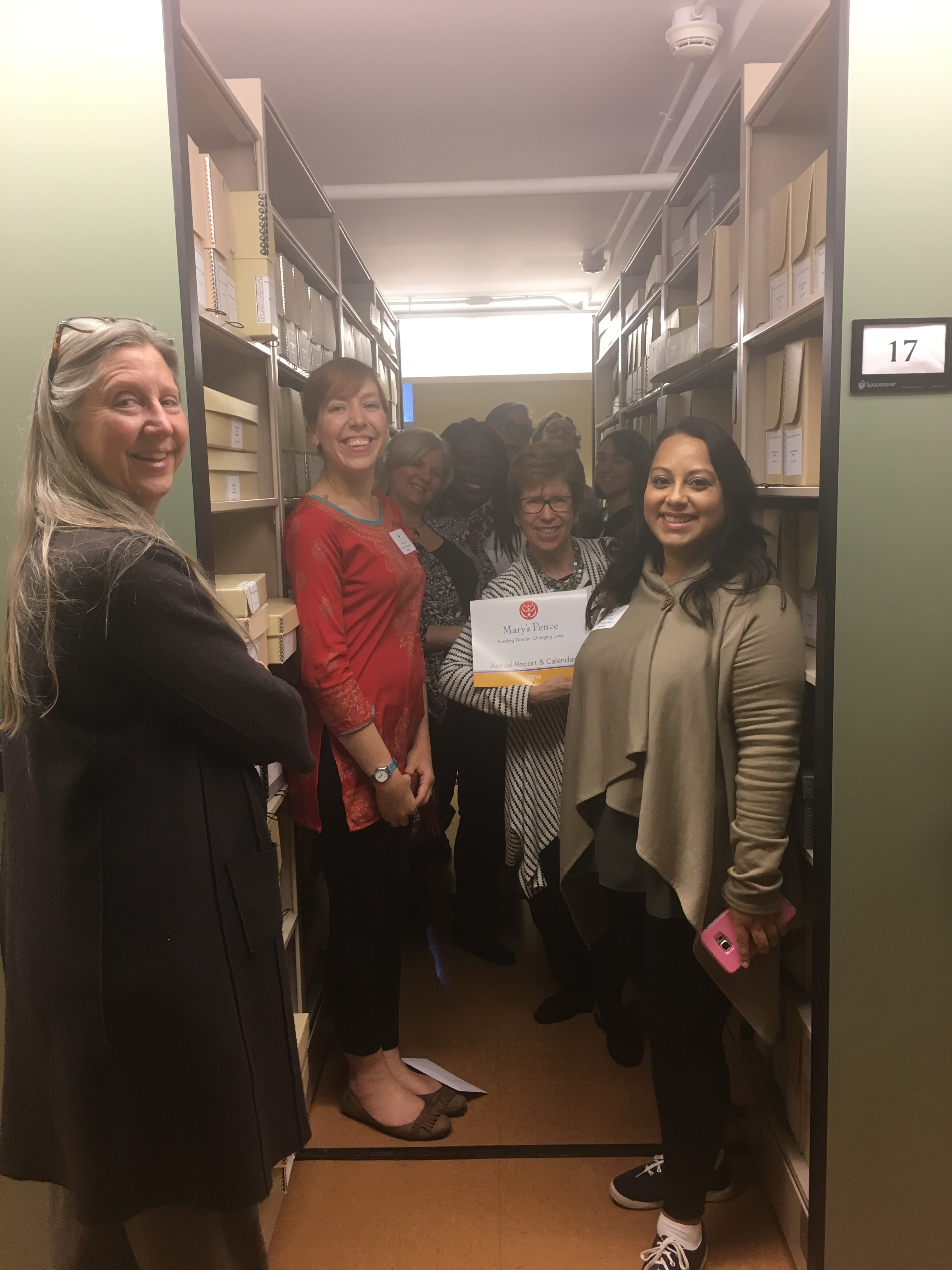 Board members from Mary's Pence view their organization's collection at the WLA.